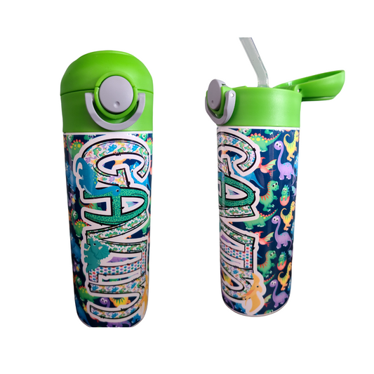 12 oz water bottle with flip top and built in straw. Colorful dinosaur themed water bottle for kids. Back to school water bottle for kids. Dinosaurs in yellow, green, purple and blue with navy blue background and green lid.